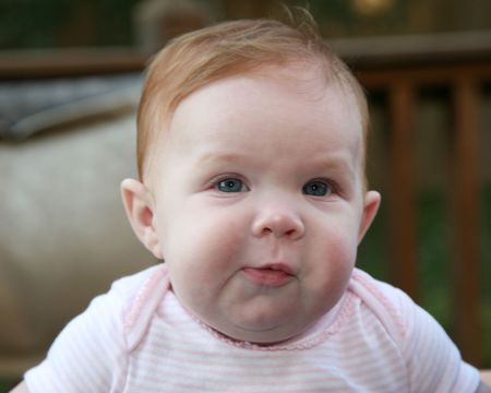 Precocious 4 month old baby girlの写真素材