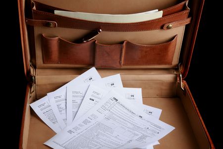 Tax forms in a leather briefcase - horizontalの写真素材