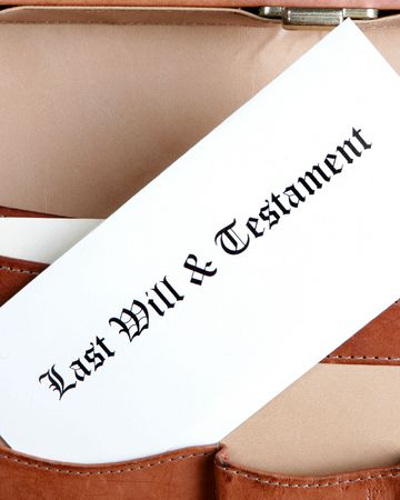 Last will & testament in a leather briefcase - verticalの写真素材