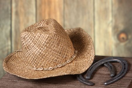 Western scene with cowboy hat and horseshoesの写真素材