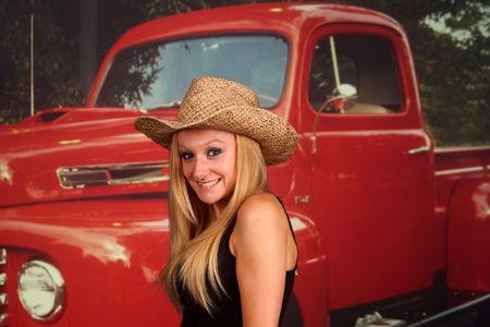 Country girl in front of an old pickup truck, no markings on truckの写真素材