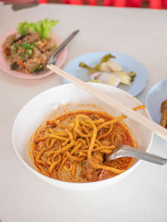 famous traditional khao soi in lana chiang mai yellow spicy taste noodle soup style. Local Thai style food with curry base soupの写真素材