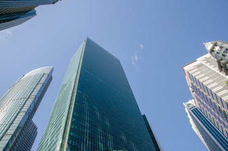 transparent glass wall of office building.Bright future, finance buildings seen from below