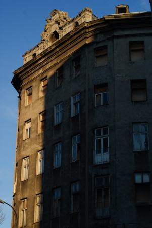 A neglected tenement in Zlota street in Warsaw  Dirty window, unkept walls and empty flats in old building in center of Warsawのeditorial素材