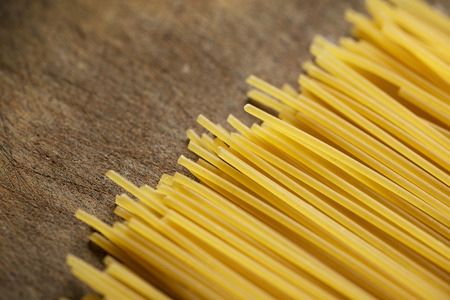 Spaghetti on old wooden tableの写真素材