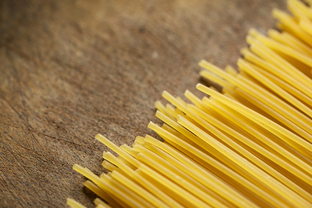 Spaghetti on old wooden tableの写真素材