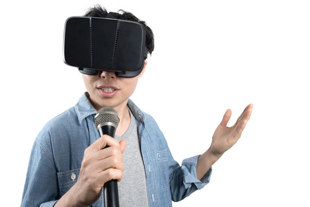 Asian man singing with VR glasses