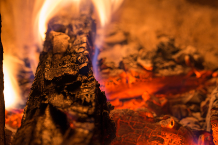 Firewood is burning in the stoveの写真素材