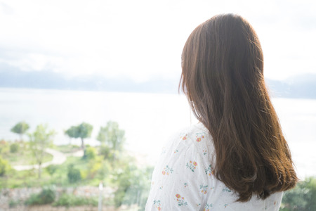 girl looking at nature viewの写真素材