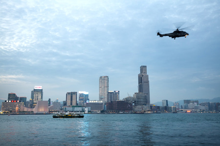 hongkong,china - may,11,2017: helicopter is flying on victoria harbor hongkong.のeditorial素材