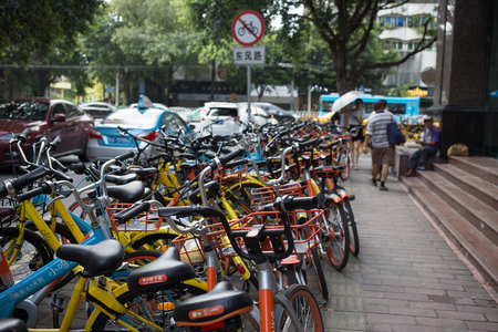 guangzhou,china - Aug,6,2017:A lot of  sharing bicycles on the street in guangzhou china.のeditorial素材