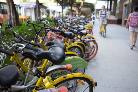 guangzhou,china - Aug,6,2017:A lot of  sharing bicycles on the street in guangzhou china.のeditorial素材