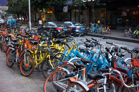 guangzhou,china - Aug,6,2017:A lot of  sharing bicycles on the street in guangzhou china.のeditorial素材