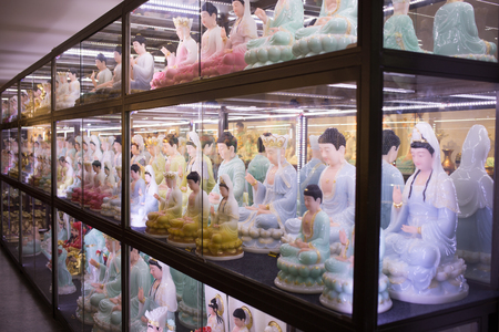 guangzhou,china - july,30,2017: A lot of buddha statue in the shop near the guangzhou guangxiao temple.のeditorial素材
