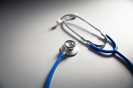 blue color stethoscope on the table