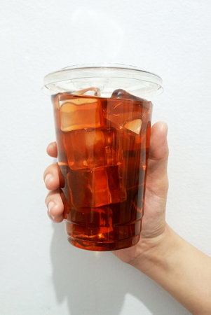 Coffee cup in hand front viewの写真素材