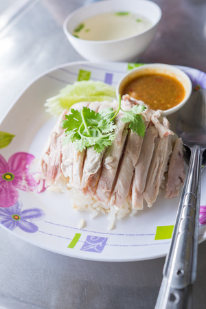 Hainanese chicken served on top of riceの写真素材