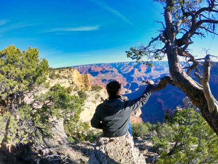 man enjoy the views on nevada, california and utah, grand canyon and horse shoe, great western of usa.の写真素材