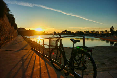 vintage bike with great sunset city landscape