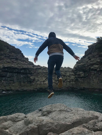man with curly hair with a bird on his head like a nestの写真素材