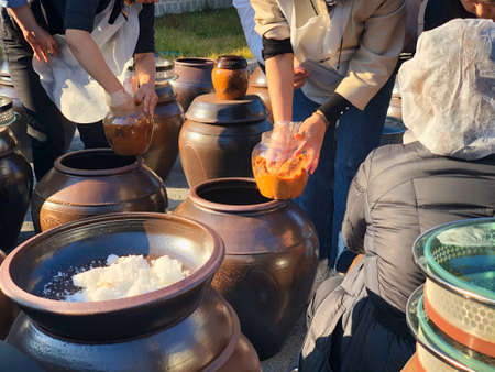 jars of korean sauce did with hands and fermentation
