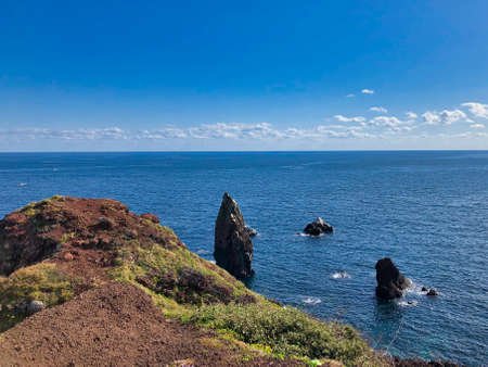 beautiful landscape views from south korea jeju island, paradise with green grass blue sea and cliffs with rocks. areal viewsの写真素材