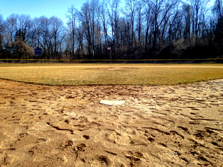 Baseball field with American Flag in backgroundの写真素材