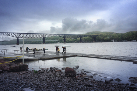 Team puts baot in the water.の写真素材