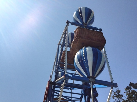 Blue ferris wheel ride in day time with blue skyの写真素材