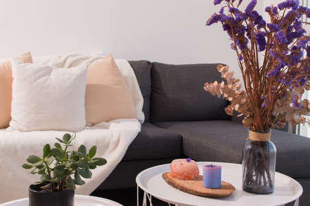 Living room decoration in the minimalist and Nordic style, with flowers and still life