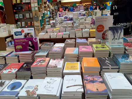 Manado, Indonesia - February 2nd, 2020: Display of books on the table in the Gramedia bookstoreのeditorial素材