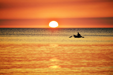 Fisherman with a beautiful sunsetの写真素材