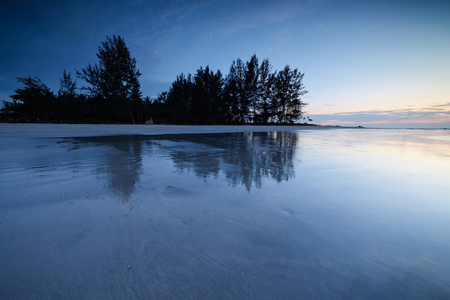 Beautiful sunset on the beach and sea with cloud and sky backgroundの写真素材