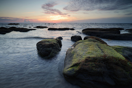 Beautiful sunset on the beach and sea with cloud and sky backgroundの写真素材
