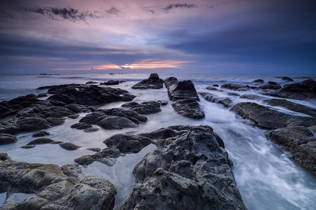 Beautiful sunset on the beach and sea with cloud and sky backgroundの写真素材