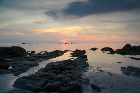 Beautiful sunset on the beach and seaの写真素材