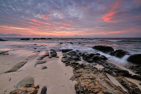 Colorful sunset on the tropical beach with beautiful sky, cloudsの写真素材