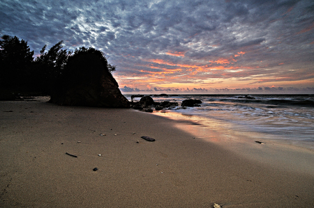 Colorful sunset on the tropical beach with beautiful sky, cloudsの写真素材
