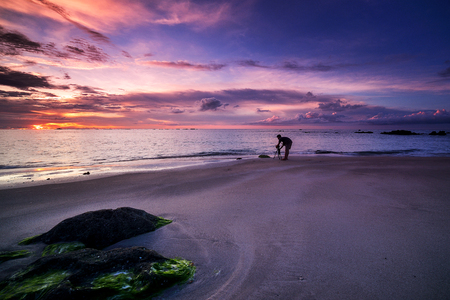 Colorful sunset on the tropical beach with beautiful sky, cloudsの写真素材