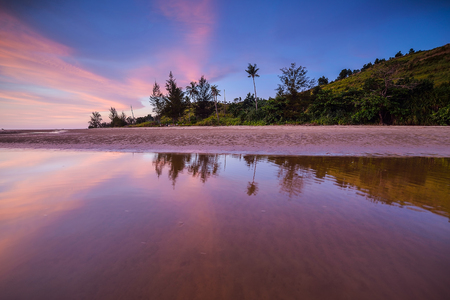 Colorful sunset on the tropical beach with beautiful sky, cloudsの写真素材