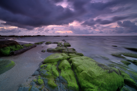 Colorful sunset on the tropical beach with beautiful sky, cloudsの写真素材