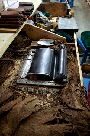 A cigar rolling machine Inside a cigar factory in Esteli in the northern mountains of Nicaraguaの写真素材