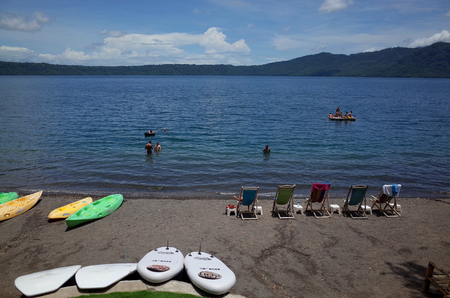 13TH SEPTEMBER 2014, GRANADA, NICARAGUA - tourists relax at Largo de Apoyo, a volcanic crater lake near Granada for relaxing and water sportsのeditorial素材