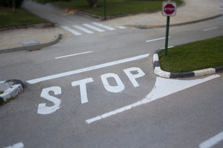 Stop sign on a roadの写真素材