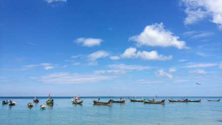 beautiful background on the beach with many fishing boatの写真素材