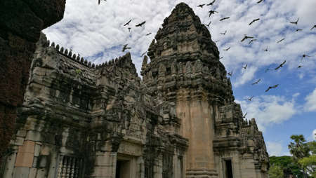 old temple Phimai with bird in skyの写真素材