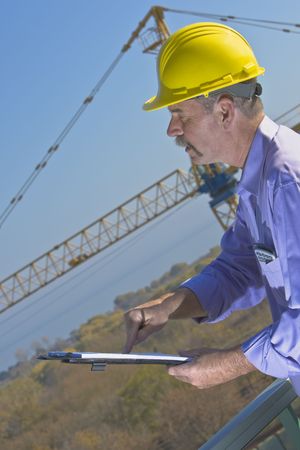 Architect advising contructor to follow working drawingsの写真素材