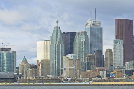A new residential development dwarfs the landmark Royal York Hotel in downtown Toronto. November 16th, 2008. Editorial use onlyのeditorial素材