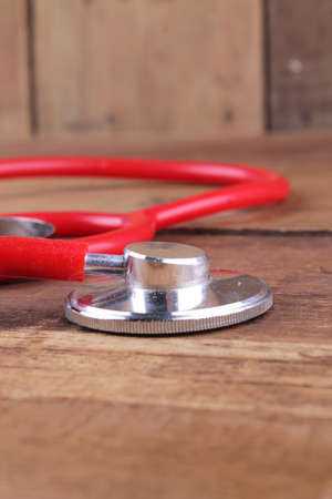 stethoscope equipment on wood floorの写真素材