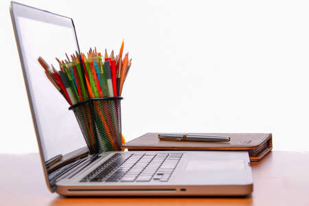 Working space. Laptop, notepad on wooden desk